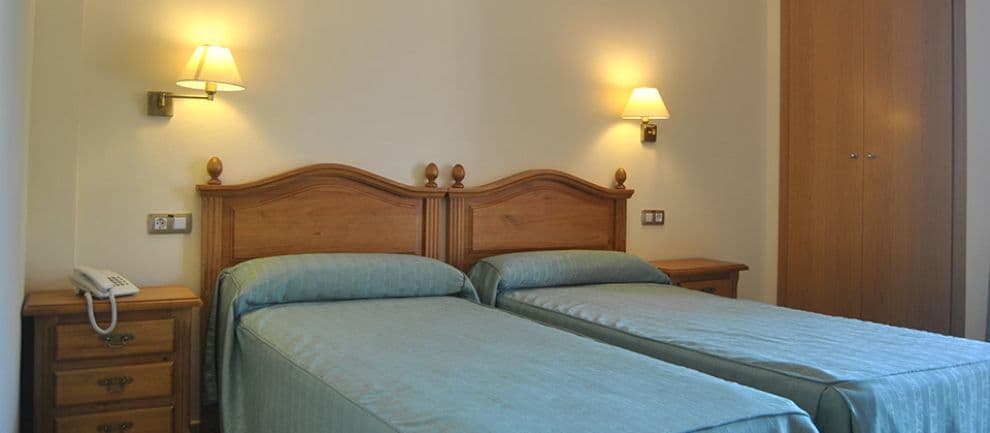 Room with two single beds and a cozy atmosphere